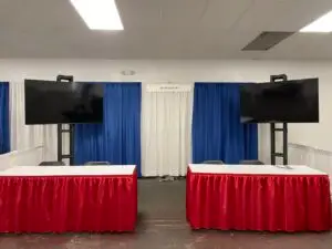 an HDTV display at an indoor event